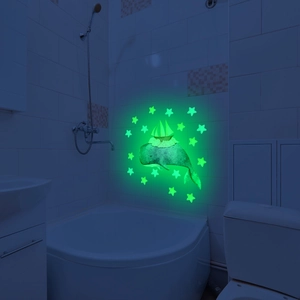 Luminous glow-in-the-dark whale and ship wall sticker on a bathroom tile wall