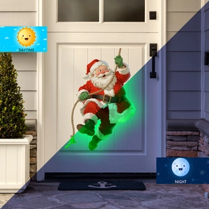 Glow-in-the-dark Santa Claus wall sticker showing daytime and night green luminous effect
