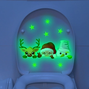 Luminous Christmas decals featuring Santa, reindeer, and stars glowing in the dark