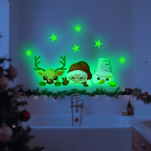 Glow-in-the-dark Christmas wall stickers showing Santa and reindeer on a bathroom wall