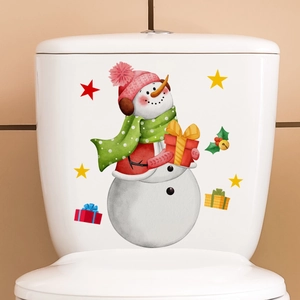 Detail view of a cartoon snowman wall sticker with pink hat on a white toilet tank