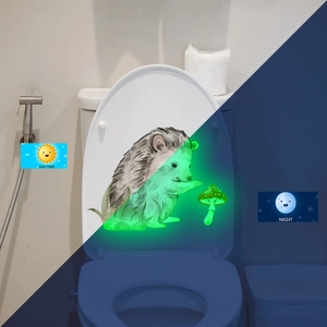 Glow in the dark hedgehog and mushroom toilet seat sticker shown in day and night view