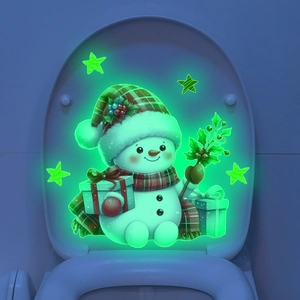 Luminous Christmas snowman toilet sticker glowing green in dark bathroom decor
