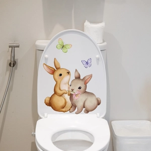 Detailed view of hand-painted rabbit and butterfly luminous toilet stickers decor