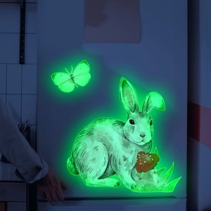 Luminous wall stickers with rabbit, mushroom and butterfly glowing in the dark on fridge