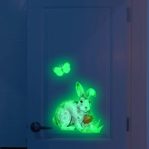 Glow-in-the-dark wall sticker of a rabbit with a mushroom and butterfly in green light