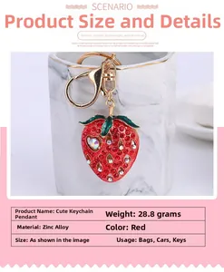 Macro shot of red crystal strawberry keychain with gold lobster clasp and alloy ring