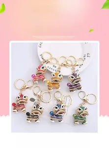 Detailed close-up of colorful enamel lion dance keychains with rhinestones and beads