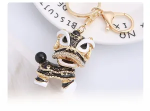 Macro detail of Chinese lion keychain with black enamel and sparkling rhinestones