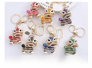 Detailed close-up of colorful lion dance keychains with rhinestones and enamel finish