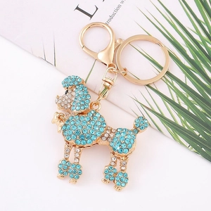 Porte-clés chien caniche strass bleu clair étincelant avec finition métal doré chic