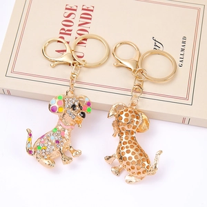 Creative golden dalmatian dog keychains with rhinestones and hollow design on vintage book