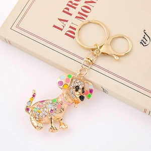 Detail of dachshund keychain with multicolor enamel dots and white rhinestones