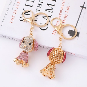 Sparkly rhinestone dog keychain in gold alloy with lobster clasp and creative charm design