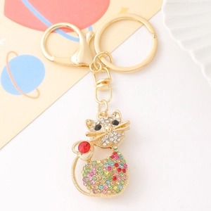 Detailed close-up of a luxury metal cat keychain with colorful inlaid rhinestones