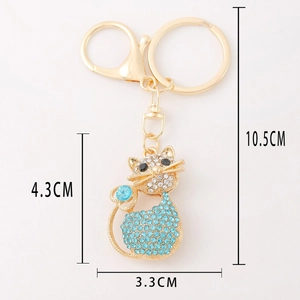 Sparkling crystal cat keychain with blue rhinestones and gold-plated metal clasp for bags
