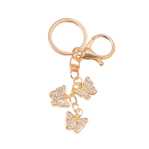 Elegant gold butterfly keychain with sparkling rhinestones on a polished metal ring