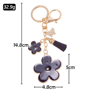 Creative butterfly and flower tassel keychain with rhinestones and black enamel detail