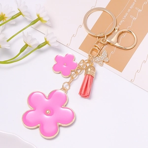 Exquisite golden butterfly and peach blossom tassel keychain with pink enamel and crystals