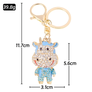 Sparkling gold ox keychain with blue rhinestones and dimensions for car bag accessory