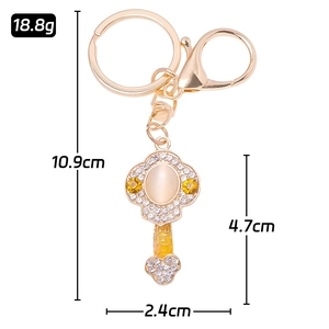 Golden Ruyi keychain with rhinestones and cat-eye stone, size 10.9cm length