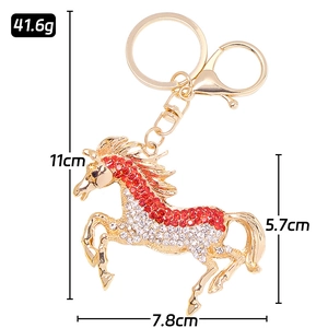 Porte-clés cheval doré créatif avec strass rouges et blancs et fermoir mousqueton