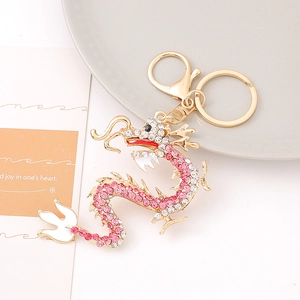 Exquisite Chinese dragon keychain with pink and white rhinestones on golden metal base