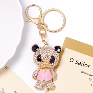 Sparkling rhinestone panda keychain with gold metal frame and pink vest detailing