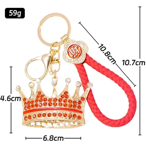 Luxury gold crown keychain with red rhinestones and braided strap for graduation gifts