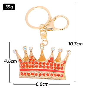 Luxurious crown keychain with red crystals and gold-tone finish in 10.7cm length
