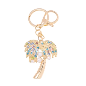 Golden palm tree keychain with colorful rhinestones and pearls on white background
