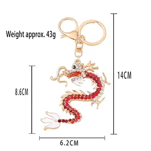 Golden Chinese dragon keychain with rhinestones and enamel, dimensions 14x6.2 cm