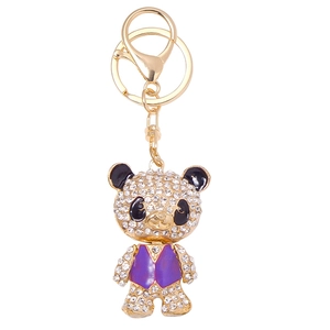 Sparkling crystal panda keychain with purple vest and golden lobster clasp on white background