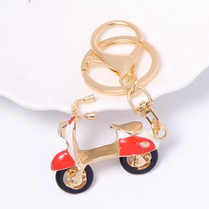 Exquisiter goldener Motorrad Schlüsselanhänger mit Strass und rot-weißer Emaille