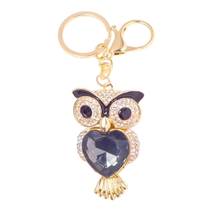 Porte-clés chouette dorée avec cristal coeur noir et strass blancs étincelants