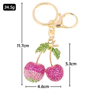 Porte-clés cerise étincelant avec strass roses et fermoir en métal doré