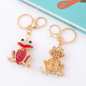 Creative gold frog keychains with red rhinestones and honeycomb pattern back
