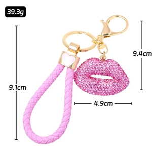 Pink rhinestone lip keychain with woven leather strap and golden ring dimensions