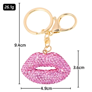 Pink rhinestone lip keychain with gold metal ring and spring clasp measurements
