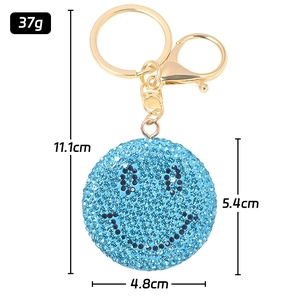 Portachiavi smiley con strass blu con anello in metallo dorato e chiusura a moschettone