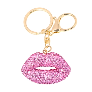 Detailed view of pink rhinestone lip keychain with gold metal clasp and ring charm