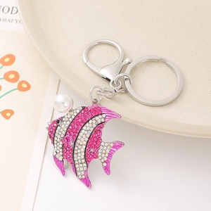 Sparkling tropical fish keychain with pink rhinestones and a large white pearl detail