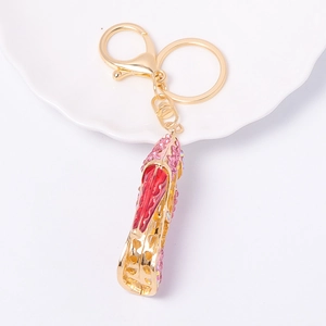 Sparkly high heel keychain with pink and red rhinestones on a gold metal base