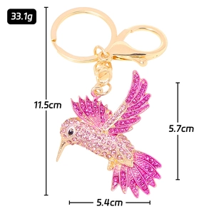 Luxuriöser Schlüsselanhänger mit Kolibri aus Metall und rosa glitzernden Kristallen