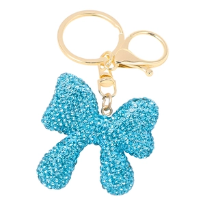 Close-up of blue rhinestone bow keychain with golden lobster clasp and metal ring