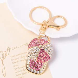 Sparkling rhinestone baseball cap keychain with pink crystals and gold metal ring