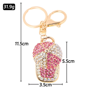Baseball cap keychain with pink and white rhinestones and size specifications