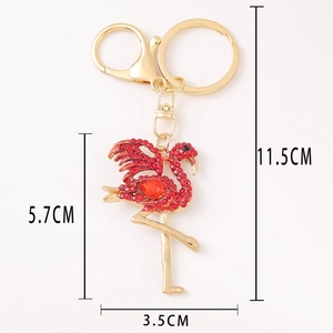 Porte-clés flamant rose doré avec strass rouges et crochet à ressort pour sac