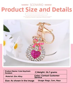 Macro detail of fortune bag keychain with pink rhinestones and heart on zinc alloy