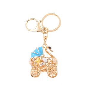 Elegant gold swan stroller keychain with colorful gemstones and sparkling rhinestones